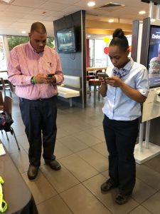 Marquis helps a colleague register as a donor online.