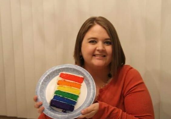 Stephanie Green holds a rainbow cake. Rainbows continue to be a symbol of hope for those on the waiting list. 