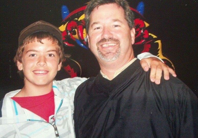 A young Kyle Hutchins with his father, Tom.